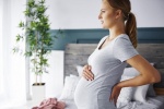 Mẹ bầu thường bị đau lưng, chuột rút và nhiều triệu chứng khác trong 3 tháng giữa thai kỳ